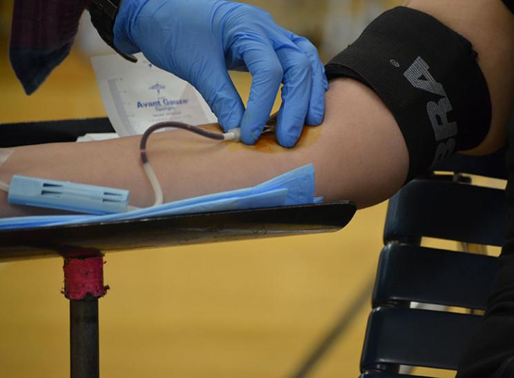 Senior+Marcia+Ruiz+donating+blood+at+the+school+blood+drive+in+the+lower+gym+on+November+14.
