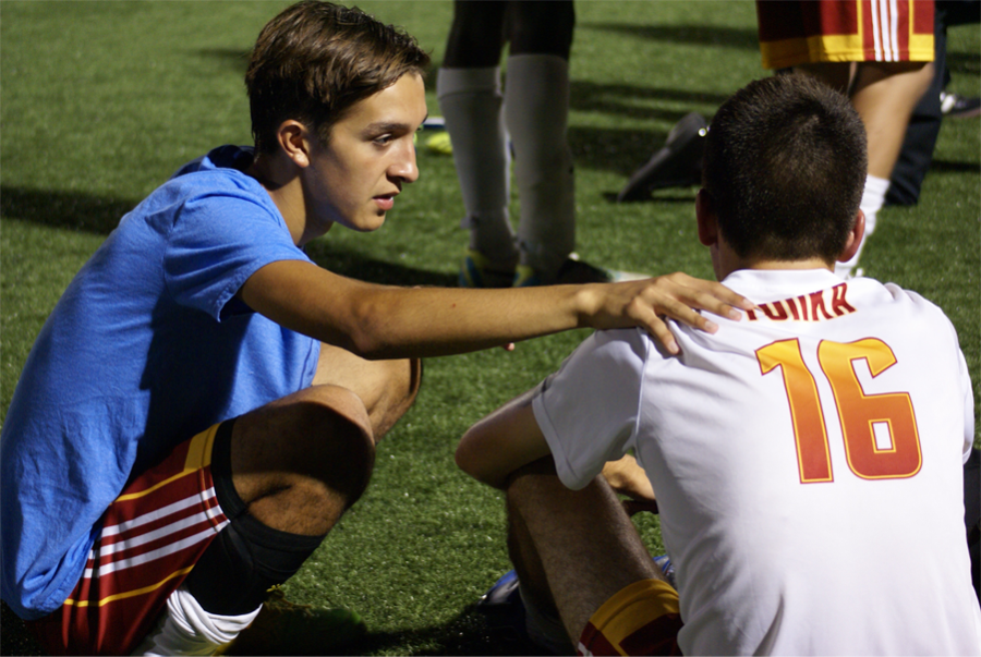 Senior+Dominic+Padilla+encouraging+his+teammate+senior+Tyler+Kalm+after+a+soccer+game+on+August+27.