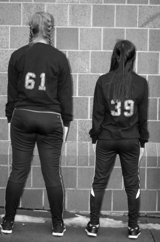 Juniors Jessica Gebauer (left) and Sally Dishman (right) wearing the shirts they made for #blackoutbullying. The numbers on the back of their shirts represent the percentage of votes they received on the poll poster to Twitter.
