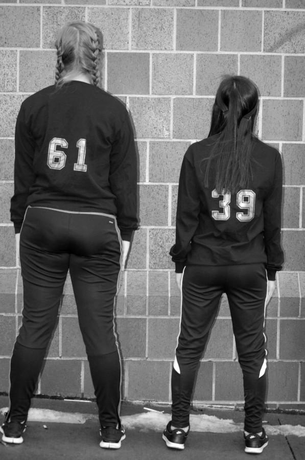 Juniors Jessica Gebauer (left) and Sally Dishman (right) wearing the shirts they made for #blackoutbullying. The numbers on the back of their shirts represent the percentage of votes they received on the poll poster to Twitter.