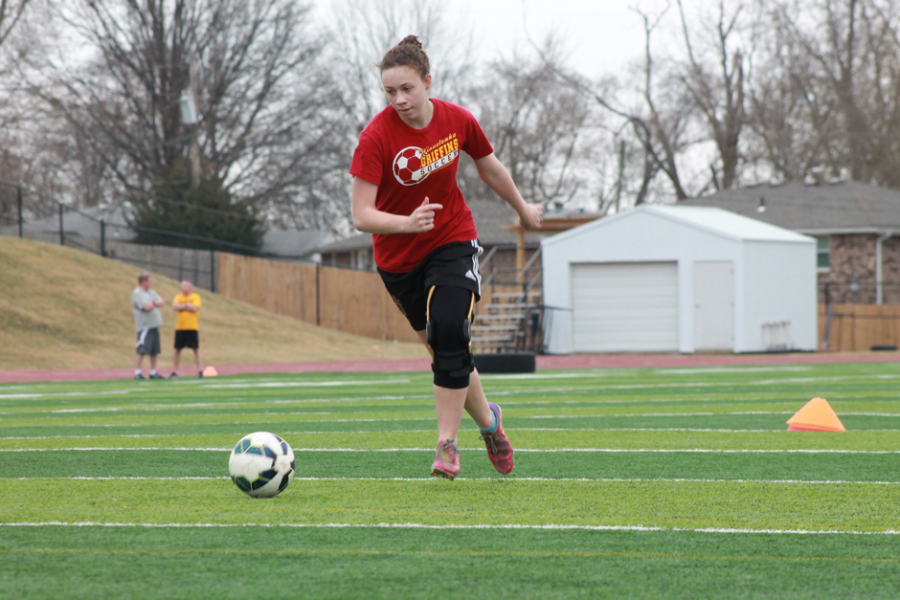 Senior Emily Glotfelty practicing her passes on March 7.