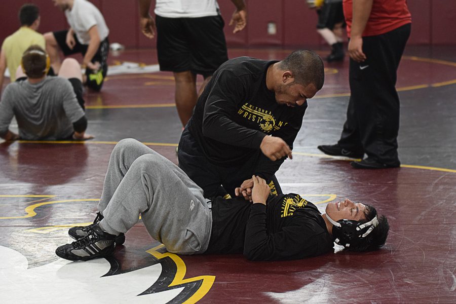 Senior+Michael+Aquino+gives+some+advice+to+his+younger+brother%2C+freshman+Jordan+Aquino+during+practice+after+being+able+to+overpower+Jordan+in+a+short+amount+of+time.