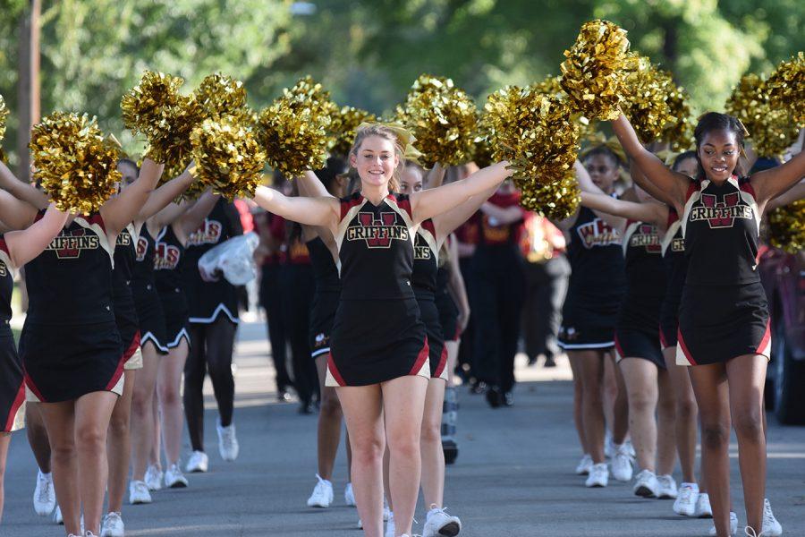The cheer team walks in the homecoming parade on Sept. 23.