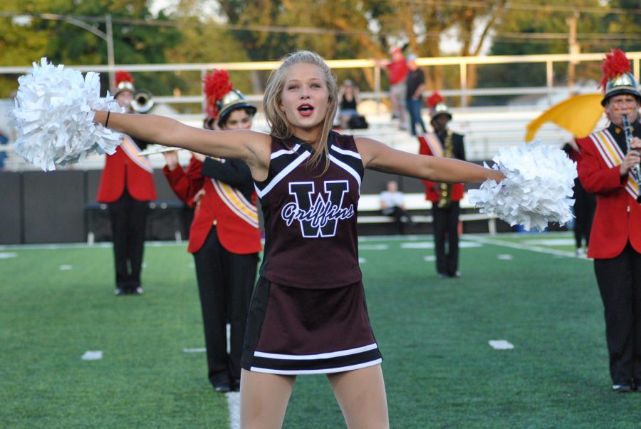 Sophomore Christine Harpe dances before the homecoming football game on Sept. 23.