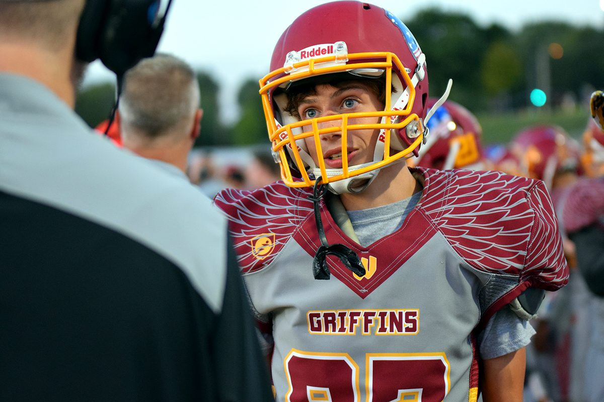 Senior+Hayden+Weathermen+talks+to+his+coach+after+attempting+a+field+goal+kick+in+the+first+ever+varsity+football+home+game+held+at+Tonka+on+Sept.+29.