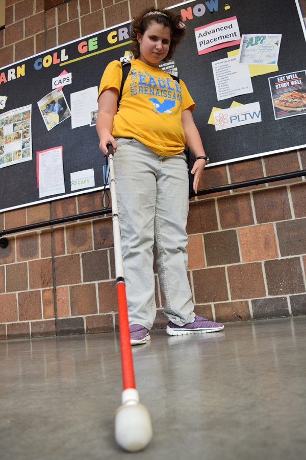 Freshman Sarah Coccovizzo, who was born blind, uses landmarks like the stairways to help her find her way around the school.